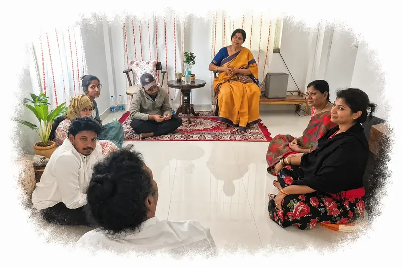 Villagers gathered for a community satsang, sharing a quiet moment of reflection.